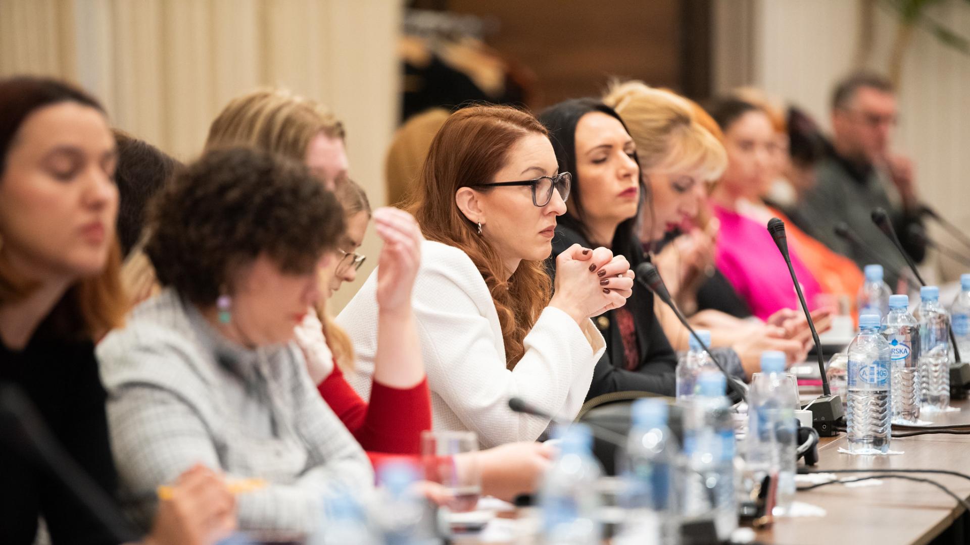 Group of people sitting in a conference