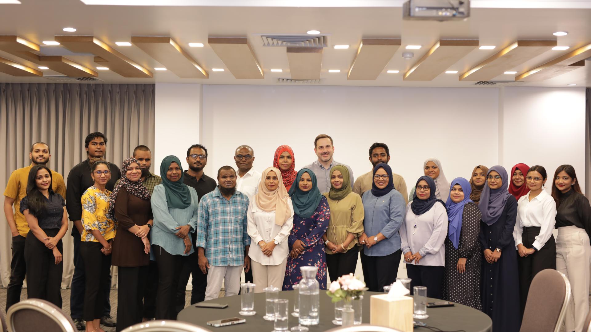A group photo of CSO members participating in an event in Maldives