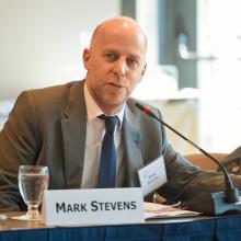Mark Stephens, a white man in a suit and tie, speaking into a microphone