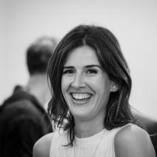 A woman smiling at the camera